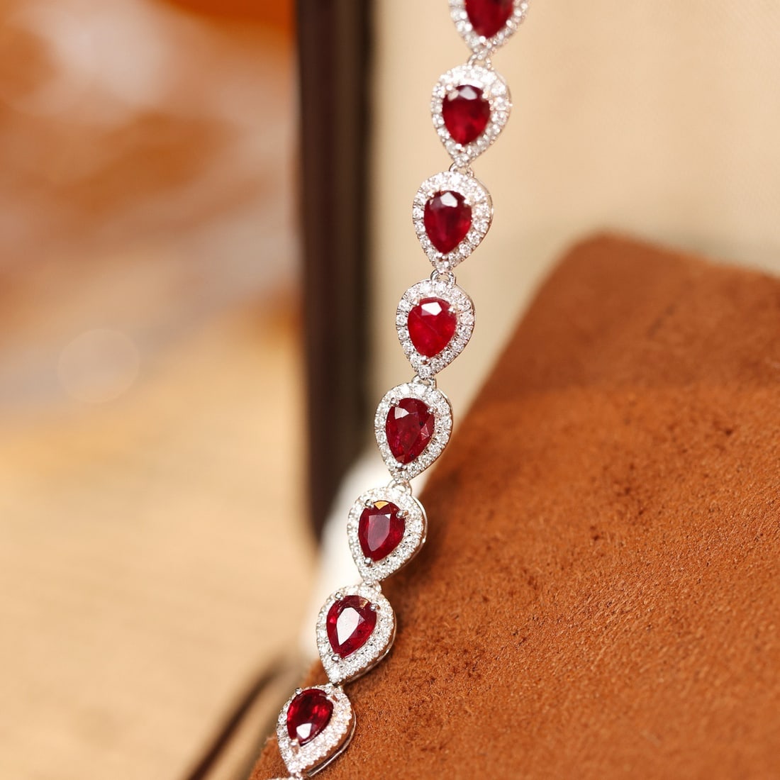 14k Gold 3.01 Ctw Natural Ruby & Diamond Bracelet: Ref:231116365 // gold content:14k gold // main gemstone:ruby // shape:pear // carat weight:2. 43ct // color:pigeonblood red // treatment:natural // // adjacent gemstone 2 : diamond // shape:round