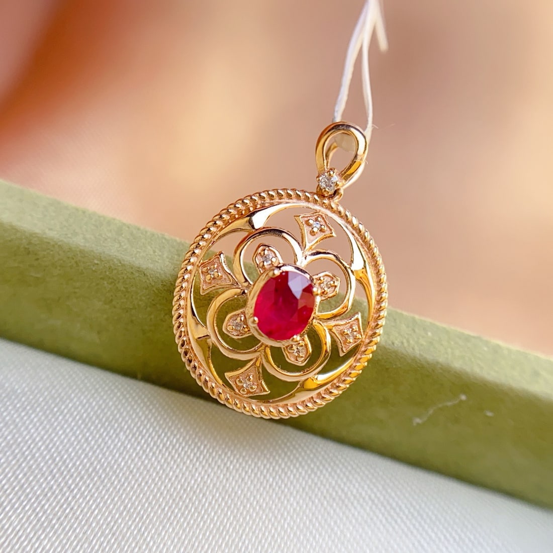 14k Gold 0.35 Ct Natural Ruby & Diamond Pendant( Without Chain ): Ref:231116413 // gold content:14k gold // main gemstone:ruby // shape:oval // carat weight:0. 35ct // color:red // treatment:natural // // adjacent gemstone 2 : diamond // number of stones:9 //