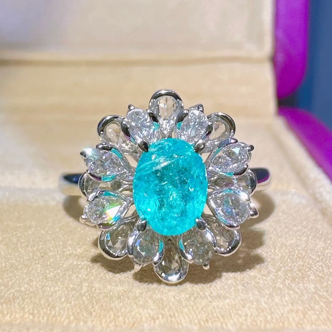 14k Gold 1.21 Ctw Natural Paraiba Tourmaline & Diamond Ring: Ref:231116417 // gold content:14k gold // ring size:7. 25us // // main gemstone:paraiba tourmaline // shape:oval // carat weight:0. 62ct // color:blue // treatment:natural // // adjacent gemstone 2 :