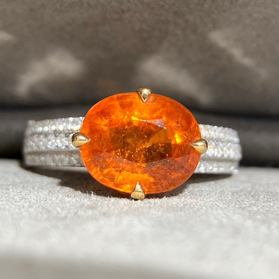 14k Gold 4.30 Ctw Natural Spessartine & Diamond Ring: Ref:231116420 // gold content:14k gold // ring size:7. 25us // // main gemstone:spessartine // shape:oval // carat weight:3. 95ct // color:orange // treatment:natural // // adjacent gemstone 2 :