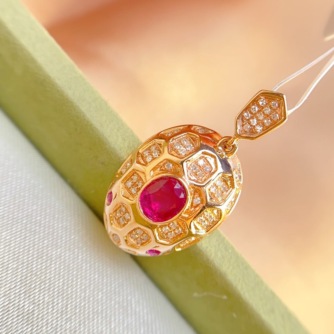 14k Gold 0.55 Ct Natural Ruby & Diamond Pendant( Without Chain ): Ref:231116427 // gold content:14k gold // main gemstone:ruby // shape:oval // carat weight:0. 55ct // color:red // treatment:natural // // adjacent gemstone 2 : diamond // number of stones:63 //