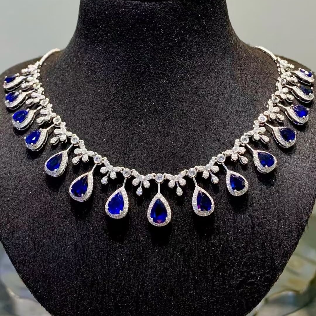 14k Gold 7.2 Ct Natural Sapphire & Diamond Necklace: Ref:231107003 // gold content:14k gold // main gemstone:sapphire // shape:pear // carat weight:7. 2ct // color:blue // treatment:natural // // adjacent gemstone 2 : diamond // shape:round // clarity g