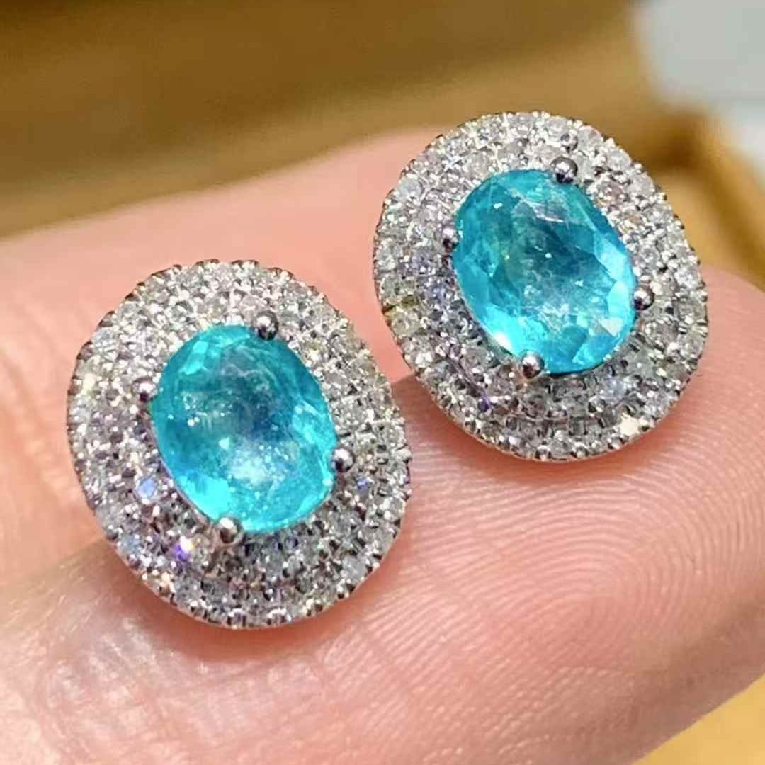 14k Gold 0.8 Ct Natural Paraiba Tourmaline & Diamond Earrings: Ref:231107050 // gold content:14k gold // main gemstone:paraiba tourmaline // shape:oval // carat weight:0. 8ct // color:blue // treatment:natural // // adjacent gemstone 2 : diamond // shape:round //