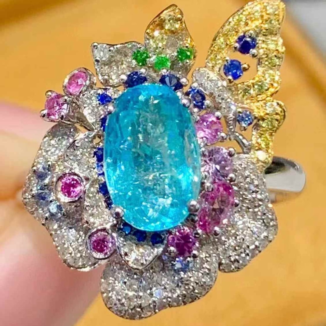 14k Gold 1.44 Ct Natural Paraiba Tourmaline & Diamond Ring: Ref:231107088 // gold content:14k gold // ring size:7. 25us // // main gemstone:paraiba tourmaline // shape:oval // carat weight:1. 44ct // color:blue // treatment:natural // // adjacent gemstone