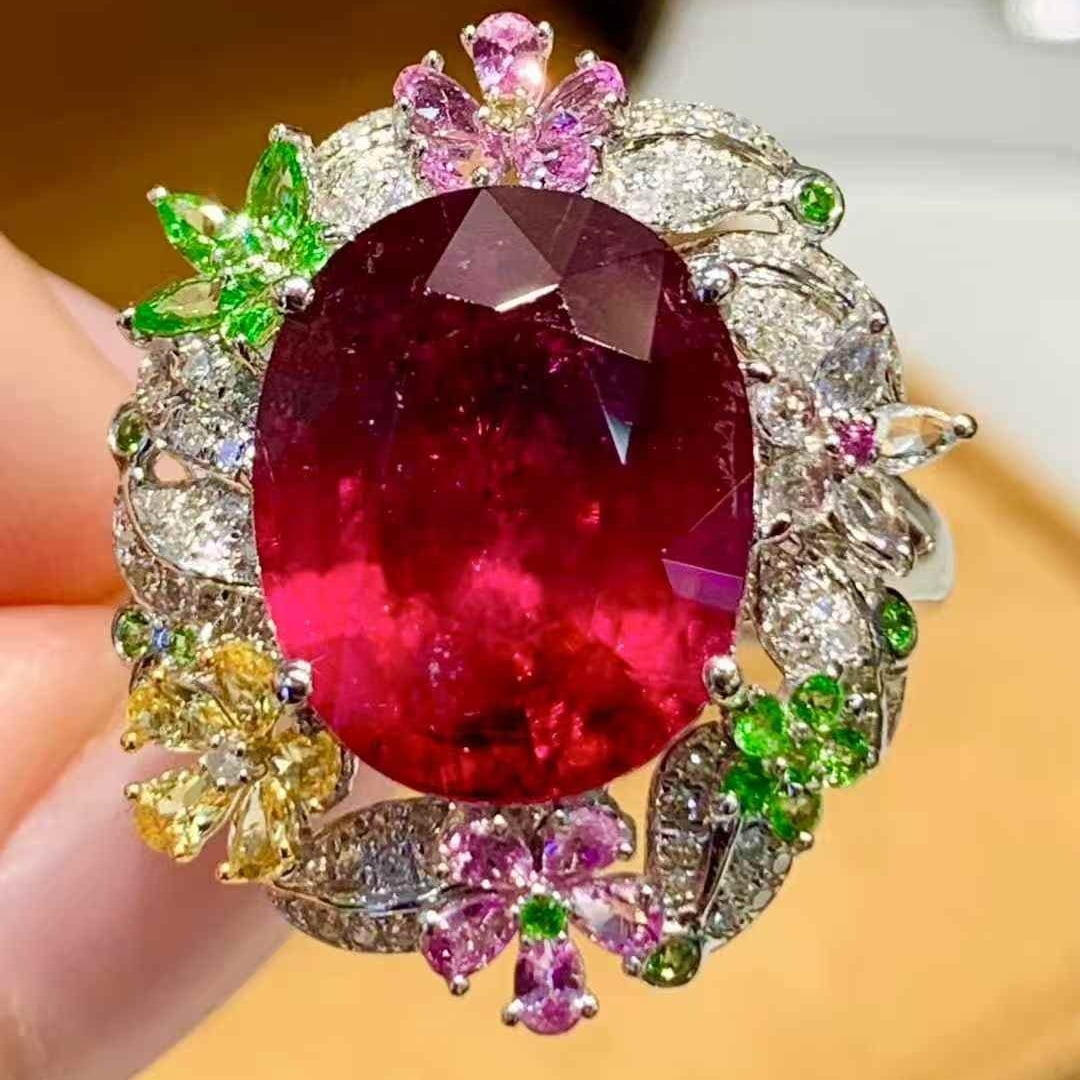 14k Gold 5.2 Ct Natural Tourmaline & Diamond Ring: Ref:231107089 // gold content:14k gold // ring size:7. 25us // // main gemstone:tourmaline // shape:oval // carat weight:5. 2ct // color:red // treatment:natural // // adjacent gemstone 2 : diamond //