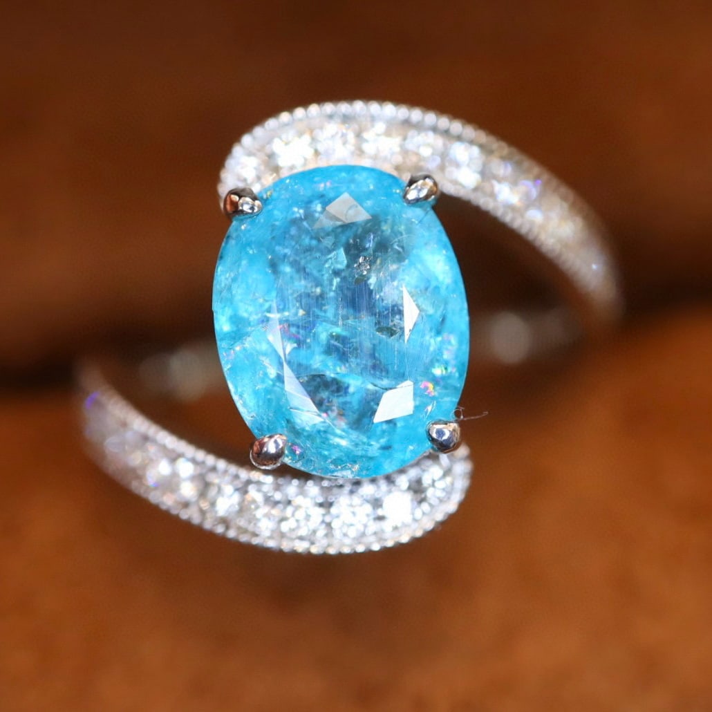 14k Gold 2.40 Ctw Natural Paraiba Tourmaline & Diamond Ring: Ref:231107222 // gold content:14k gold // ring size:7. 25us // // main gemstone:paraiba tourmaline // shape:oval // carat weight:2. 15ct // color:blue // treatment:natural // // adjacent gemstone 2 :