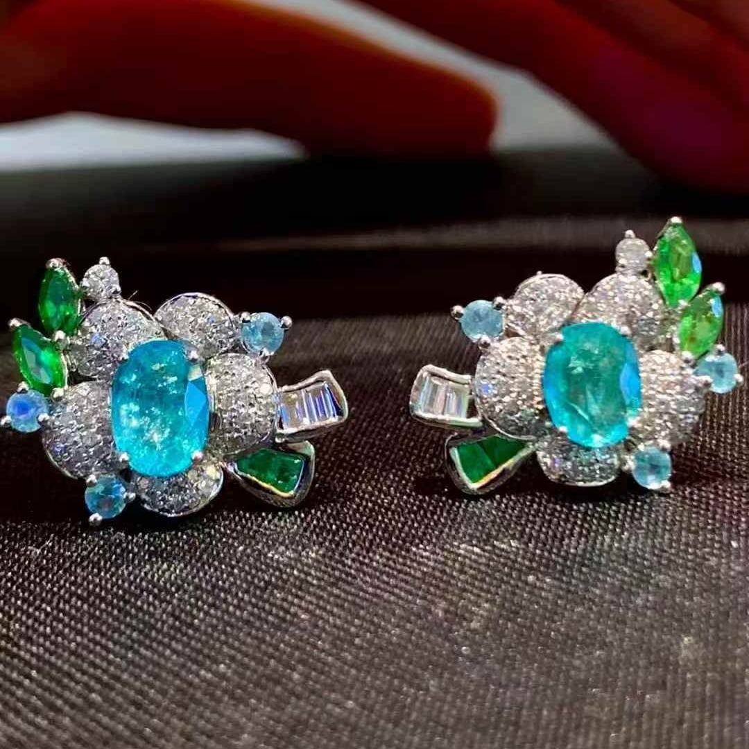 14k Gold 1.1 Ct Natural Paraiba Tourmaline & Diamond Earrings: Ref:231107224 // gold content:14k gold // main gemstone:paraiba tourmaline // shape:oval // carat weight:1. 1ct // color:blue // treatment:natural // // adjacent gemstone 2 : diamond // shape:round //