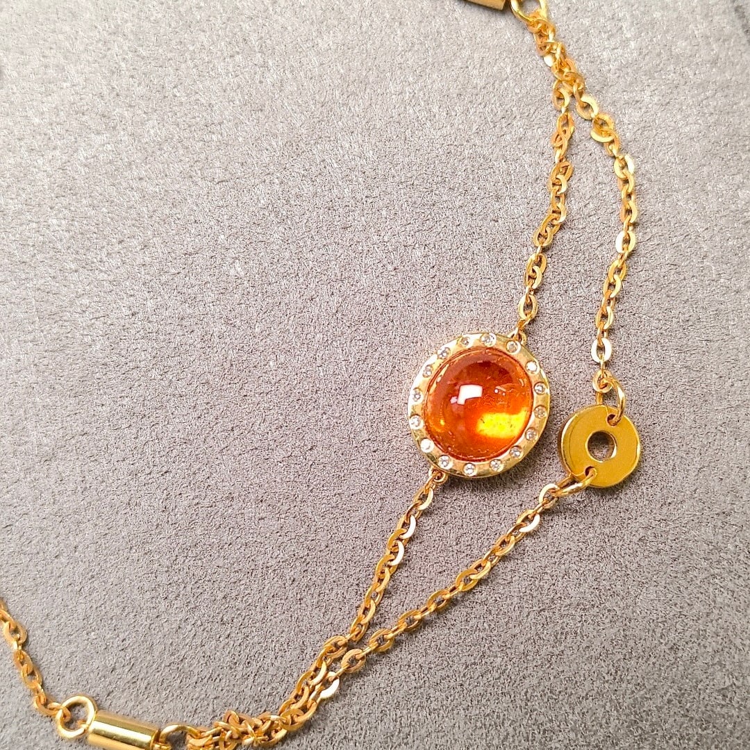 14k Gold 3.54 Ctw Natural Spessartine & Diamond Bracelet: Ref:231108104 // gold content:14k gold // main gemstone:spessartine // shape:oval // carat weight:3. 48ct // color:orange // treatment:natural // // adjacent gemstone 2 : diamond // shape:round //