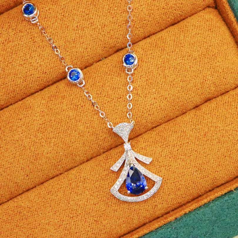 14k Gold 1.65 Ctw Natural Sapphire & Sapphire Necklace: Ref:231109112 // gold content:14k gold // main gemstone:sapphire // shape:pear // carat weight:0. 9ct // color:blue // treatment:natural // // adjacent gemstone 2 : sapphire // shape:round // carat