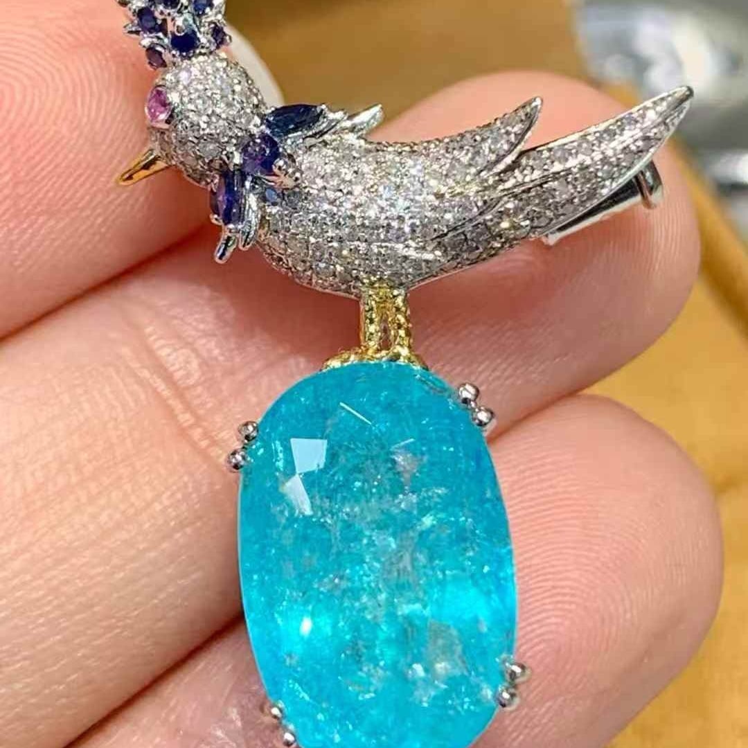 14k Gold 5.62 Ct Natural Paraiba Tourmaline & Diamond Brooch/pendant( Without Chain ): Ref:231109172 // gold content:14k gold // main gemstone:paraiba tourmaline // shape:oval // carat weight:5. 62ct // color:blue // treatment:natural // // adjacent gemstone 2 : diamond //