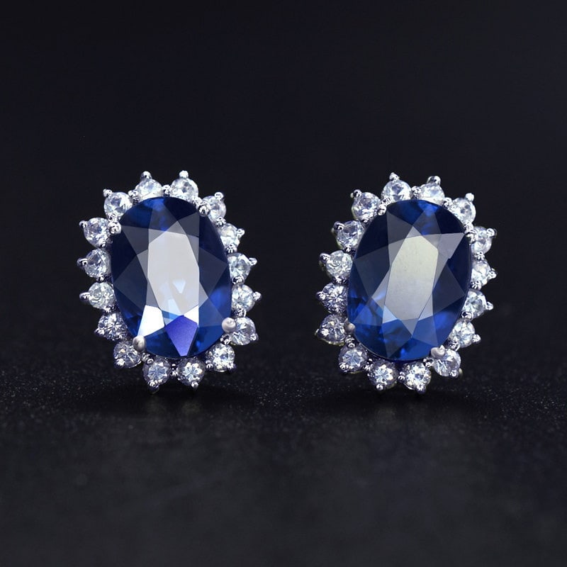 14k Gold 2.92 Ctw Natural Sapphire & Sapphire Earrings: Ref:231109190 // gold content:14k gold // main gemstone:sapphire // shape:oval // carat weight:2. 36ct // color:blue // treatment:natural // // adjacent gemstone 2 : sapphire // shape:round // carat w