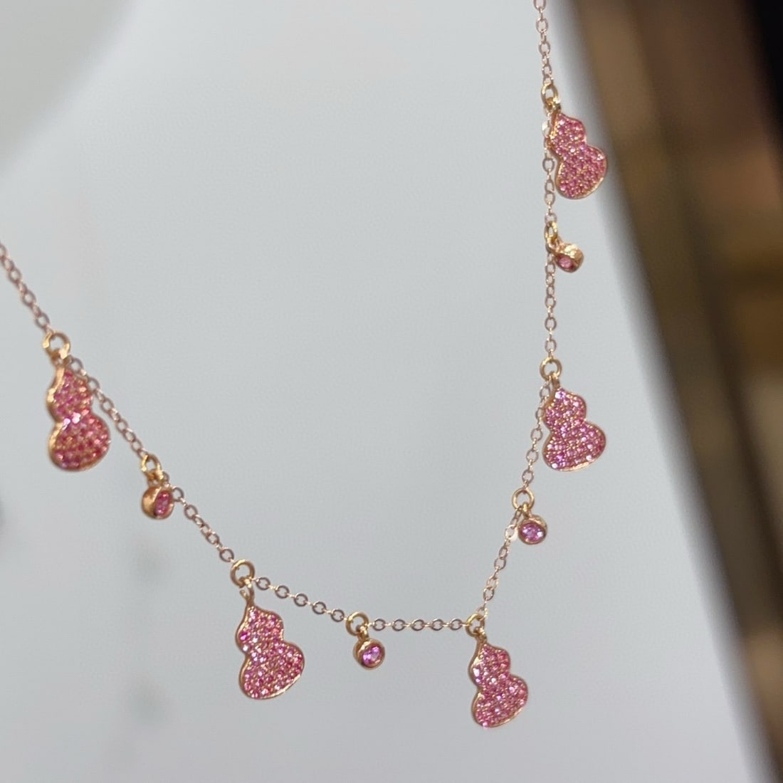 14k Gold 0.58 Ct Natural Sapphire Necklace: Ref:231109247 // gold content:14k gold // main gemstone:sapphire // shape:round // carat weight:0. 58ct // color:pink // treatment:natural // cut grade:g // Condition: NewLow Estimate: 2200.00High