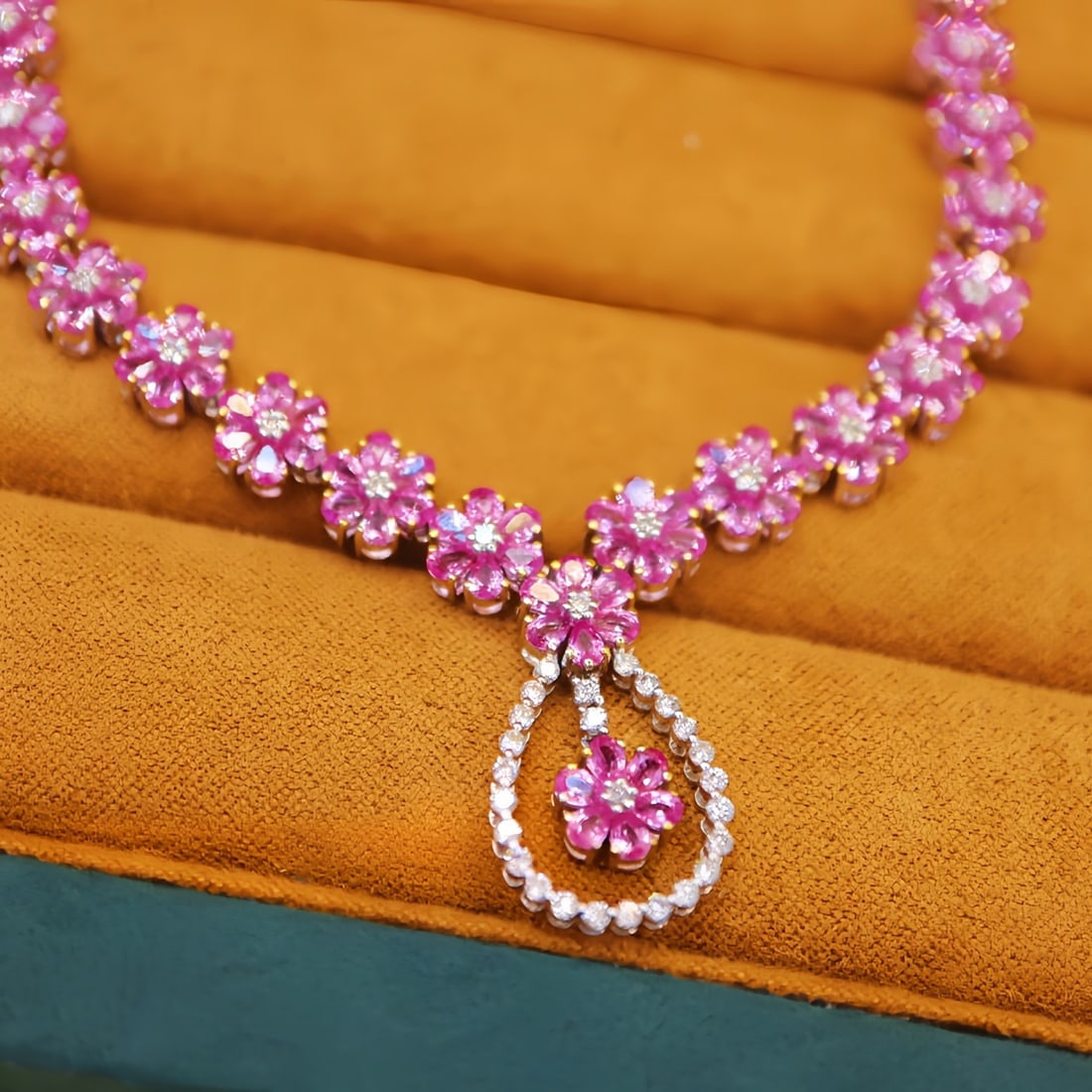 14k Gold 10.89 Ctw Natural Padparadscha Sapphire & Diamond Necklace: Ref:231110052 // gold content:14k gold // main gemstone:padparadscha sapphire // shape:pear // carat weight:10. 30ct // color:orangish pink // treatment:natural // // adjacent gemstone 2 : diamond //