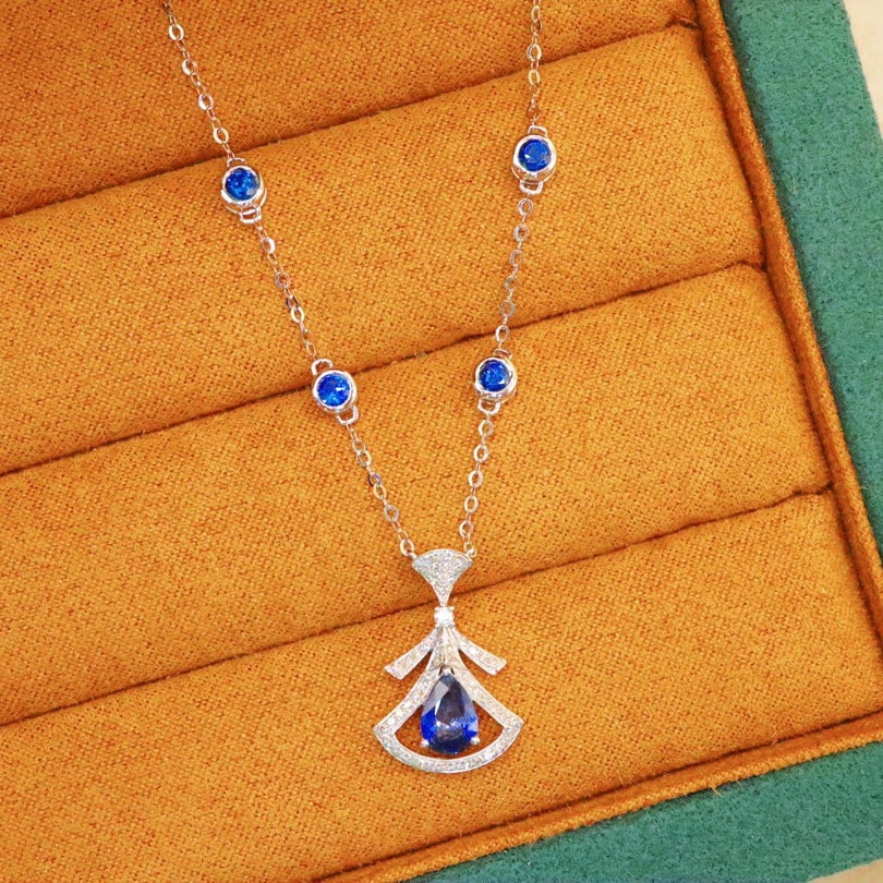 14k Gold 1.65 Ctw Natural Sapphire & Sapphire Necklace: Ref:231110059 // gold content:14k gold // main gemstone:sapphire // shape:pear // carat weight:0. 9ct // color:blue // treatment:natural // // adjacent gemstone 2 : sapphire // shape:round // carat