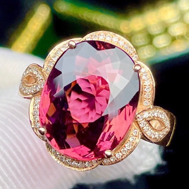 14k Gold 6.5 Ct Natural Tourmaline & Diamond Ring: Ref:231110338 // gold content:14k gold // ring size:7. 25us // // main gemstone:tourmaline // shape:oval // carat weight:6. 5ct // color:red // treatment:natural // // adjacent gemstone 2 :