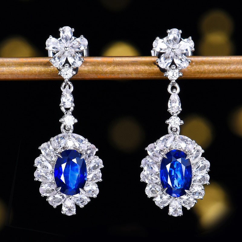 14k Gold 2.37 Ctw Natural Sapphire & Sapphire Earrings: Ref:231111108 // gold content:14k gold // main gemstone:sapphire // shape:oval // carat weight:1. 03ct // color:blue // treatment:natural // // adjacent gemstone 2 : sapphire // number of stones:38