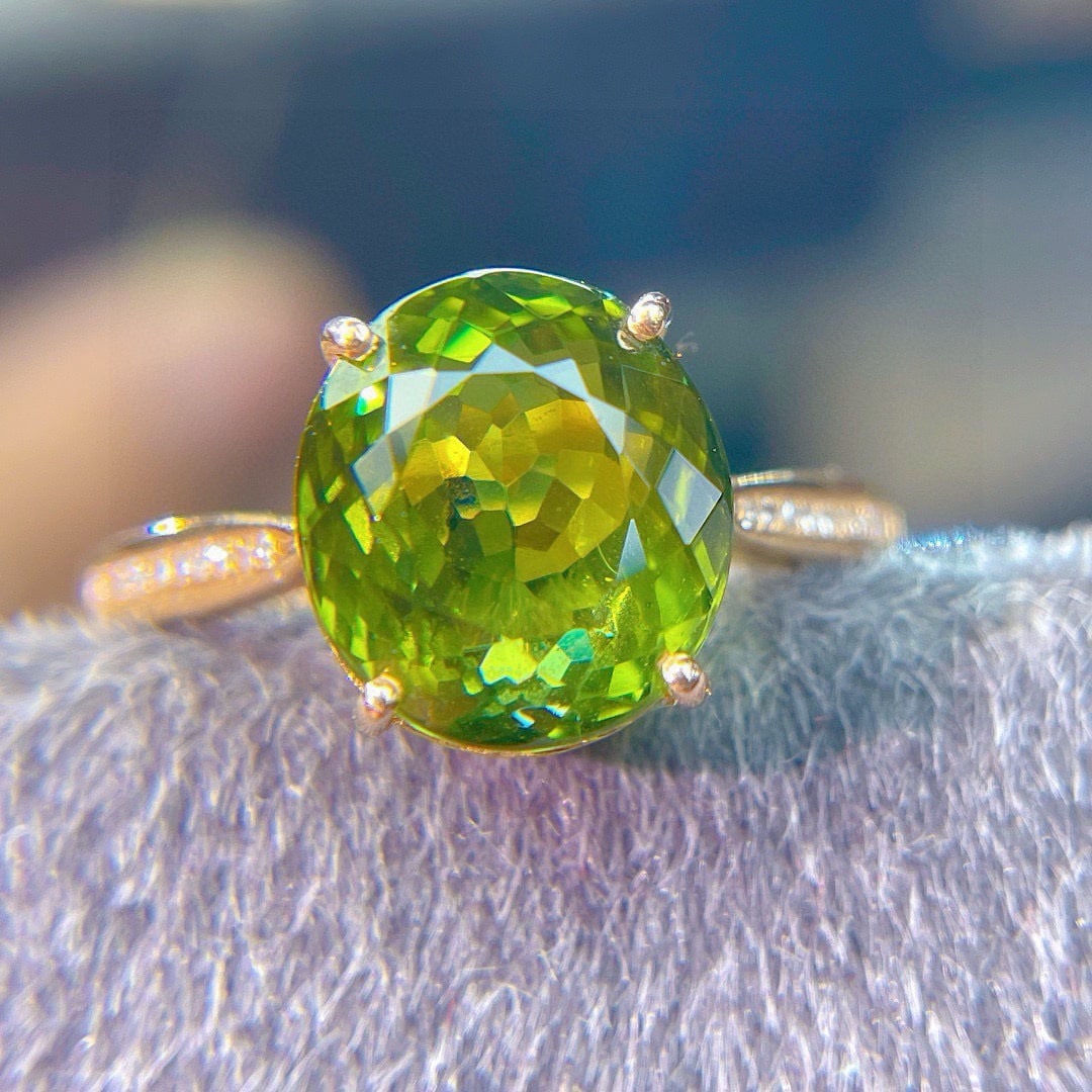 14k Gold 5.75 Ct Natural Tourmaline & Diamond Ring: Ref:231111182 // gold content:14k gold // ring size:7. 25us // // main gemstone:tourmaline // shape:oval // carat weight:5. 75ct // color:green // treatment:natural // // adjacent gemstone 2 : diamond
