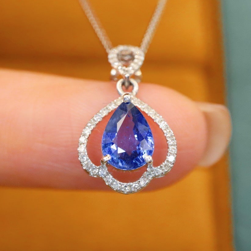 14k Gold 1.21 Ctw Natural Sapphire & Diamond Pendant( Without Chain ): Ref:231112186 // gold content:14k gold // main gemstone:sapphire // shape:pear // carat weight:1. 08ct // color:blue // treatment:natural // // adjacent gemstone 2 : diamond // number of stones:43 //