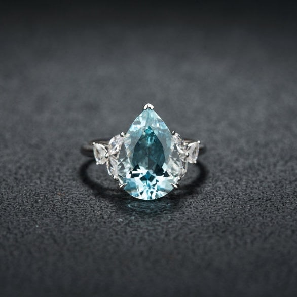 14k Gold 4.71 Ctw Natural Aquamarine & Sapphire Ring: Ref:231119062 // gold content:14k gold // ring size:7. 25us // // main gemstone:aquamarine // shape:pear // carat weight:4. 27ct // color:santa maria color // treatment:natural // // adjacent