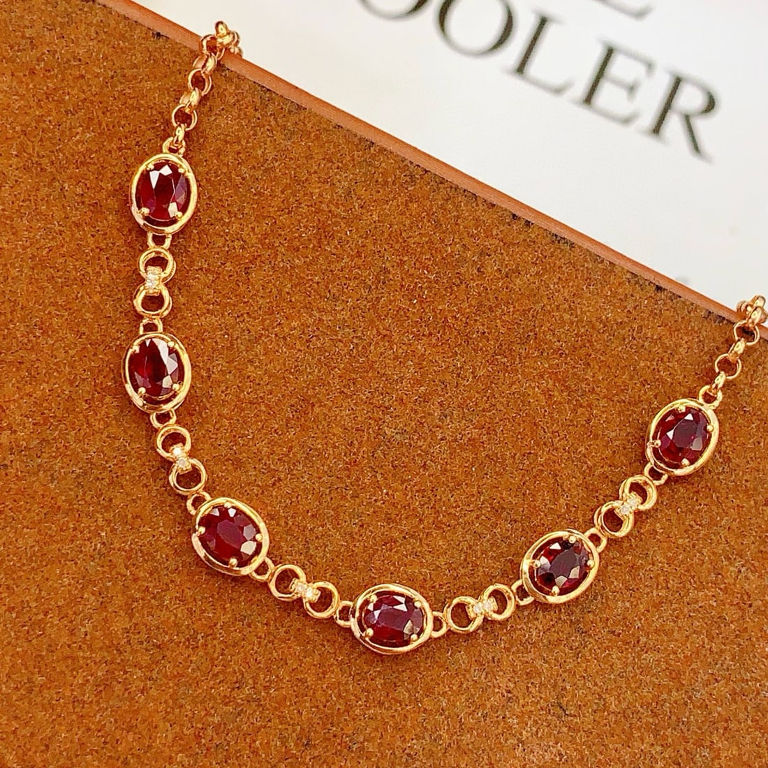 14k Gold 2.5 Ct Natural Ruby & Diamond Bracelet: Ref:231119239 // gold content:14k gold // main gemstone:ruby // shape:oval // carat weight:2. 5ct // color:red // treatment:natural // // adjacent gemstone 2 : diamond // number of stones:10 //
