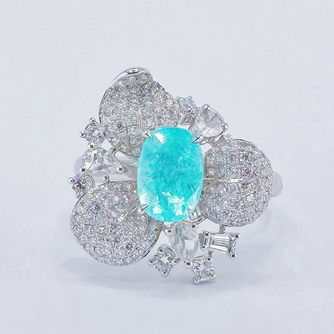 14k Gold 1.96 Ctw Natural Paraiba Tourmaline & Diamond Ring: Ref:231120095 // gold content:14k gold // ring size:7. 25us // // main gemstone:paraiba tourmaline // shape:oval // carat weight:1. 12ct // color:blue // treatment:natural // // adjacent gemstone 2 :