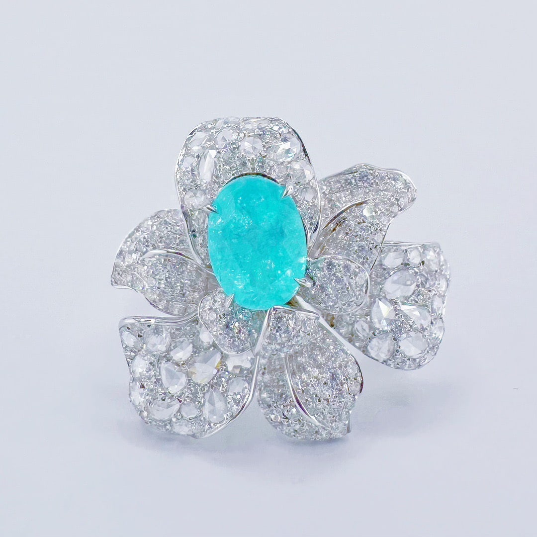 14k Gold 2.58 Ctw Natural Paraiba Tourmaline & Diamond Ring: Ref:231120135 // gold content:14k gold // ring size:7. 25us // // main gemstone:paraiba tourmaline // shape:oval // carat weight:1. 29ct // color:blue // treatment:natural // // adjacent gemstone 2 :