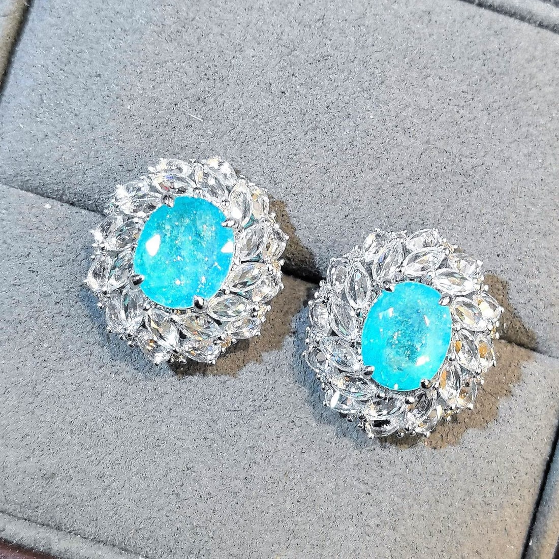 14k Gold 7.13 Ctw Natural Paraiba Tourmaline & Sapphire Earrings: Ref:231120198 // gold content:14k gold // main gemstone:paraiba tourmaline // shape:oval // carat weight:3. 83ct // color:blue // treatment:natural // // adjacent gemstone 2 : sapphire // shape:multip