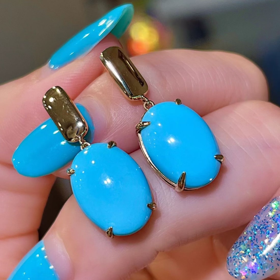 14k Gold 8.31 Ct Natural Blue Turquoise Earrings: Ref:231120228 // gold content:14k gold // main gemstone:blue turquoise // shape:oval // carat weight:8. 31ct // color:blue // treatment:natural // Condition: New Low Estimate: 4600.00 High Estimate: