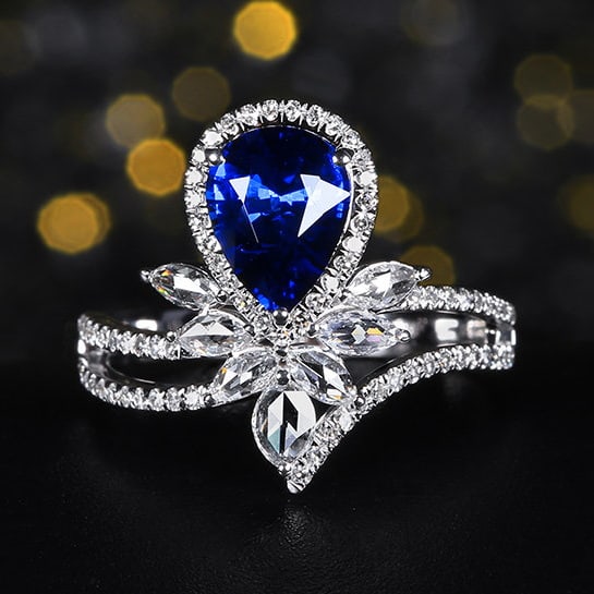14k Gold 2.11 Ctw Natural Sapphire & Diamond Ring: Ref:231120250 // gold content:14k gold // ring size:7. 25us // // main gemstone:sapphire // shape:pear // carat weight:1. 56ct // color:blue // treatment:natural // // adjacent gemstone 2 :