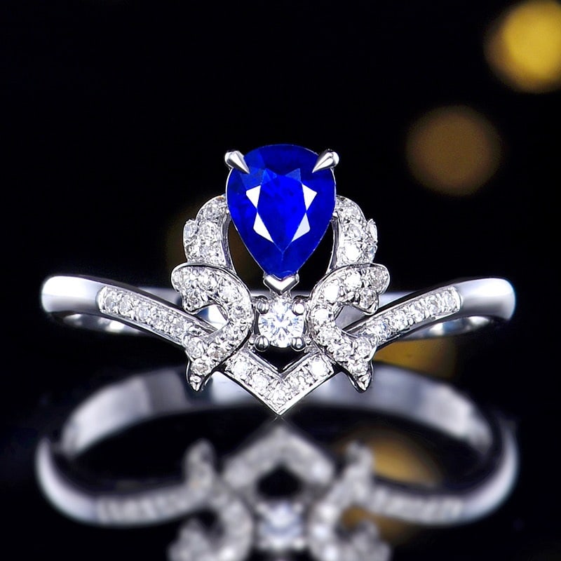 14k Gold 0.59 Ctw Natural Sapphire & Diamond Ring: Ref:231120267 // gold content:14k gold // ring size:7. 25us // // main gemstone:sapphire // shape:pear // carat weight:0. 48ct // color:blue // treatment:natural // // adjacent gemstone 2 :