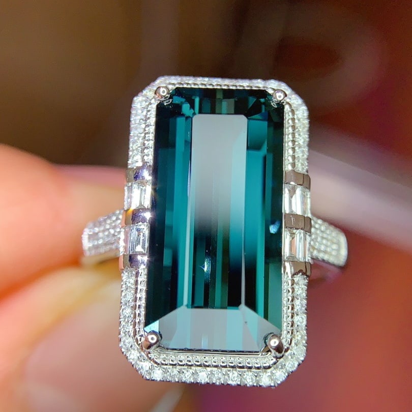 14k Gold 7.39 Ctw Natural Tourmaline & Diamond Ring: Ref:231120371 // gold content:14k gold // ring size:7. 25us // // main gemstone:tourmaline // shape:octagonal // carat weight:6. 93ct // color:blue // treatment:natural // // adjacent gemstone 2 : dia