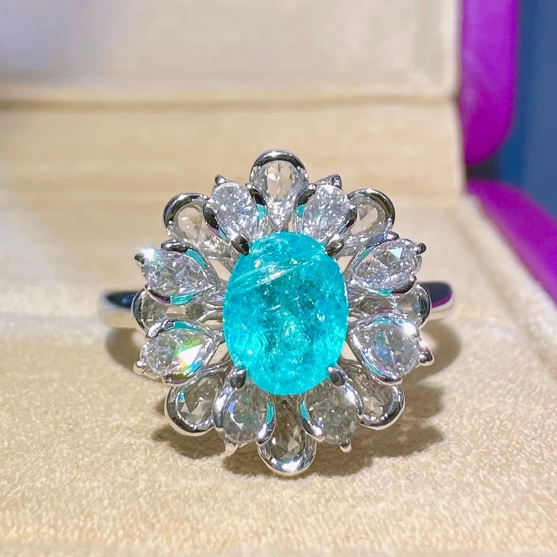 14k Gold 1.21 Ctw Natural Paraiba Tourmaline & Diamond Ring: Ref:231120383 // gold content:14k gold // ring size:7. 25us // // main gemstone:paraiba tourmaline // shape:oval // carat weight:0. 62ct // color:blue // treatment:natural // // adjacent gemstone 2 :