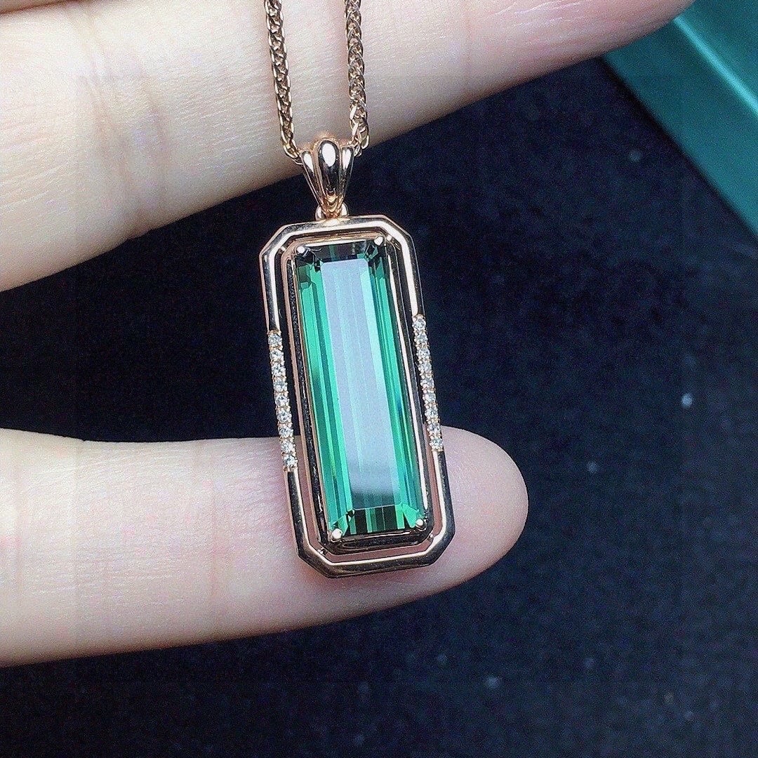 14k Gold 4.39 Ct Natural Tourmaline & Diamond Pendant( Without Chain ): Ref:231120424 // gold content:14k gold // main gemstone:tourmaline // shape:octagonal // carat weight:4. 39ct // color:green // treatment:natural // // adjacent gemstone 2 : diamond // number of