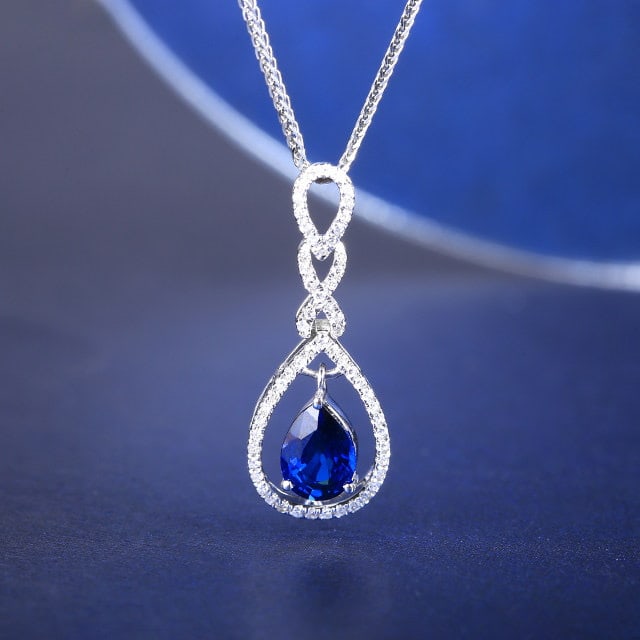 14k Gold 1.07 Ctw Natural Sapphire & Diamond Pendant( Without Chain ): Ref:231117254 // gold content:14k gold // main gemstone:sapphire // shape:pear // carat weight:0. 9ct // color:blue // treatment:natural // // adjacent gemstone 2 : diamond // number of stones:59