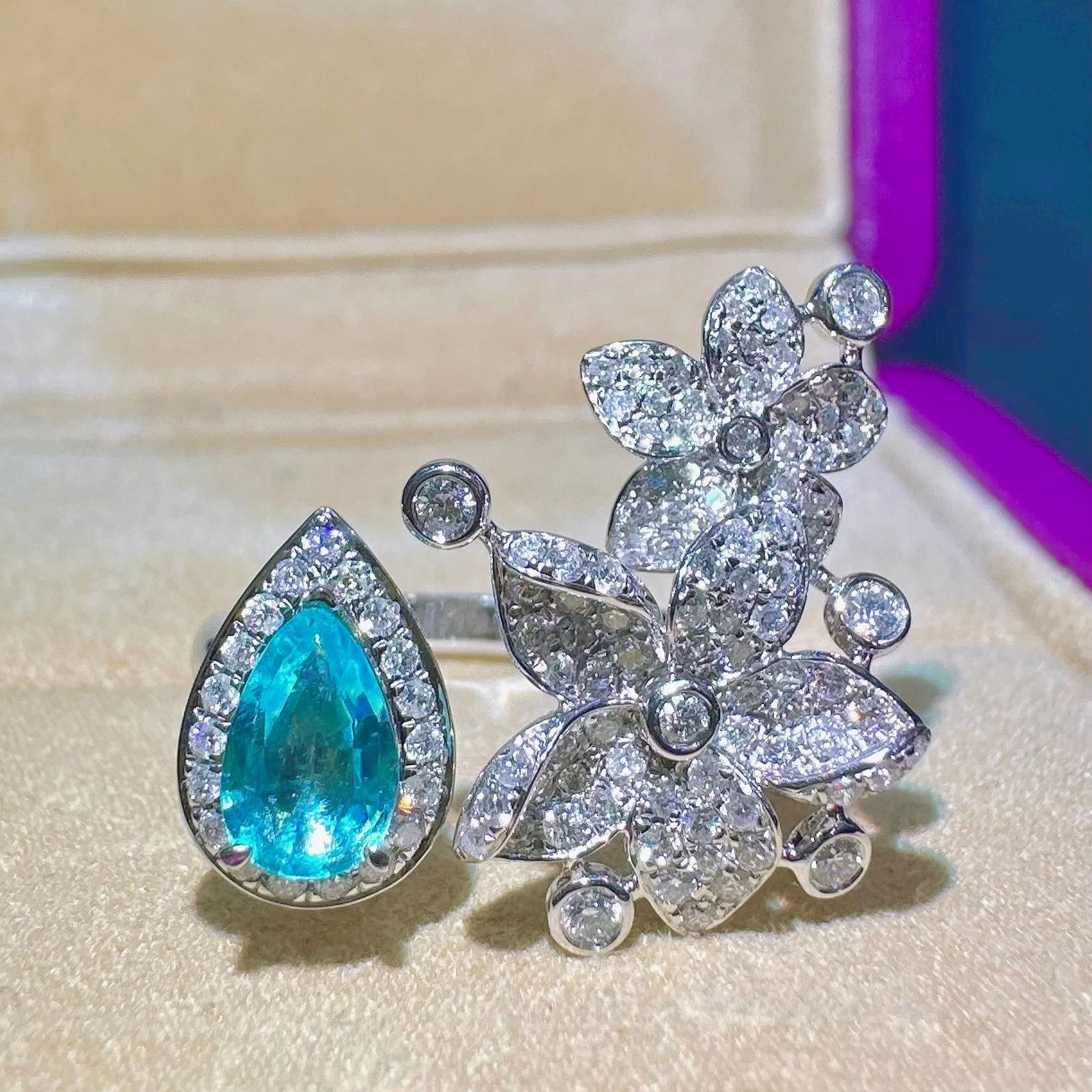 14k Gold 1.11 Ctw Natural Paraiba Tourmaline & Diamond Ring: Ref:231118163 // gold content:14k gold // ring size:7. 25us // // main gemstone:paraiba tourmaline // shape:pear // carat weight:0. 47ct // color:blue // treatment:natural // // adjacent gemstone