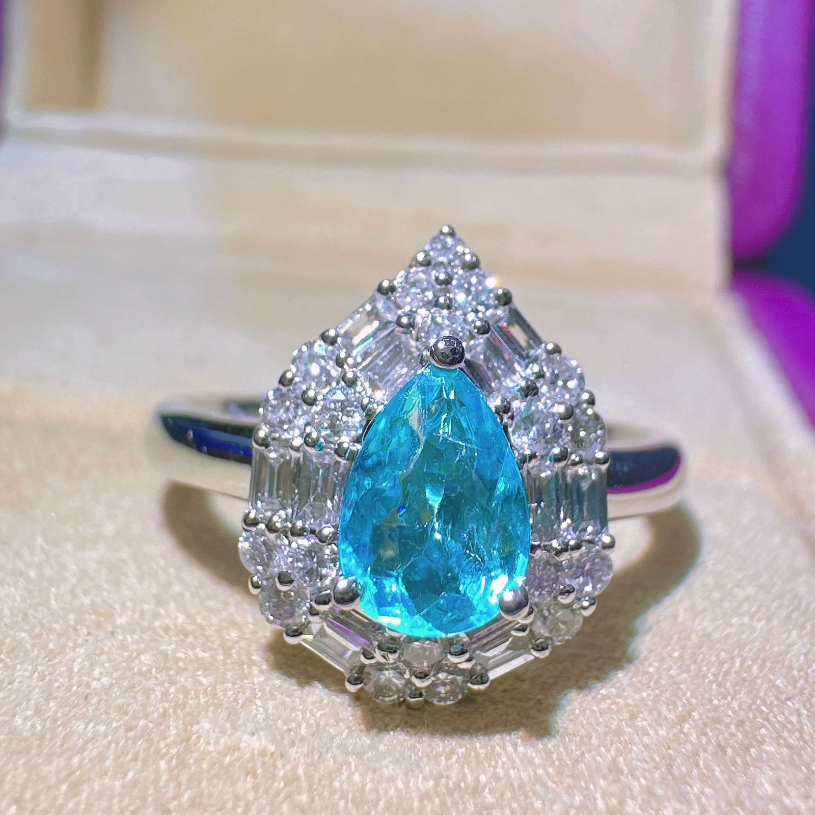 14k Gold 1.02 Ctw Natural Paraiba Tourmaline & Diamond Ring: Ref:231118267 // gold content:14k gold // ring size:7. 25us // // main gemstone:paraiba tourmaline // shape:pear // carat weight:0. 62ct // color:blue // treatment:natural // // adjacent gemstone 2 :