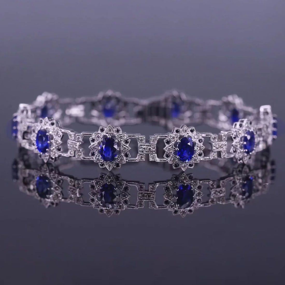 14k Gold 6.93 Ctw Natural Sapphire & Diamond Bracelet: Ref:230975005 // gold content:14k gold // main gemstone:sapphire // shape:oval // carat weight:5. 89ct // color:royal blue // treatment:natural // // adjacent gemstone 2 : diamond // shape:round // ca