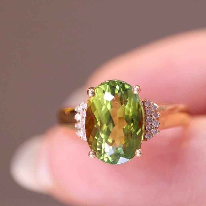 14k Gold 4 Ct Natural Tourmaline & Diamond Ring: Ref:230975057 // gold content:14k gold // ring size:7. 25us // // main gemstone:tourmaline // shape:oval // carat weight:4ct // color:green // treatment:natural // // adjacent gemstone 2 : diamond //