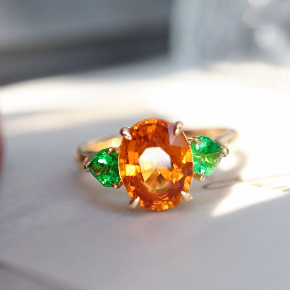 14k Gold 2.92 Ctw Natural Spessartine & Tsavorite Ring: Ref:230975093 // gold content:14k gold // ring size:7. 25us // // main gemstone:spessartine // shape:oval // carat weight:2. 40ct // color:orange // treatment:natural // // adjacent gemstone 2 :