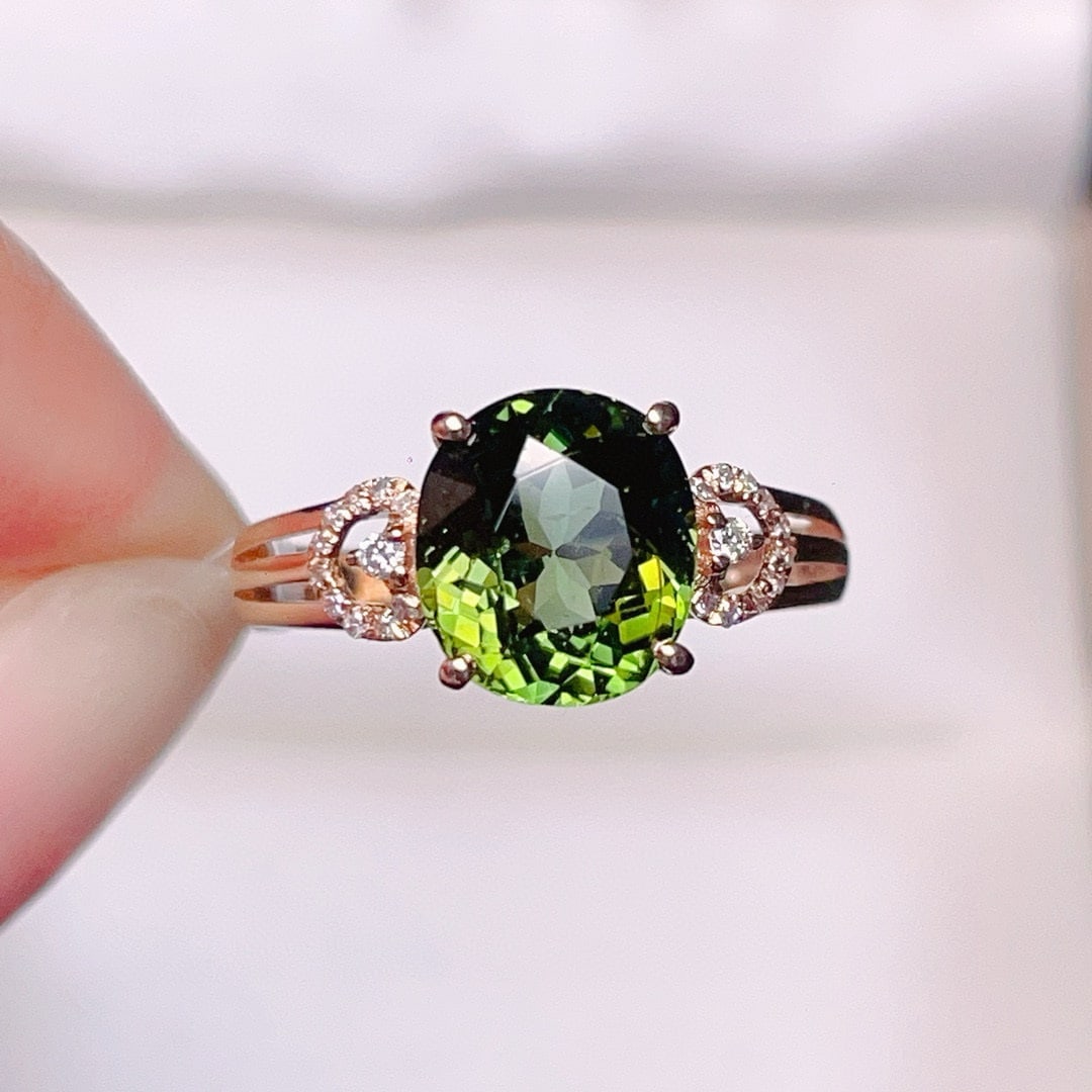 14k Gold 2.7 Ct Natural Tourmaline & Diamond Ring: Ref:230975172 // gold content:14k gold // ring size:7. 25us // // main gemstone:tourmaline // shape:oval // carat weight:2. 7ct // color:green // treatment:natural // // adjacent gemstone 2 :