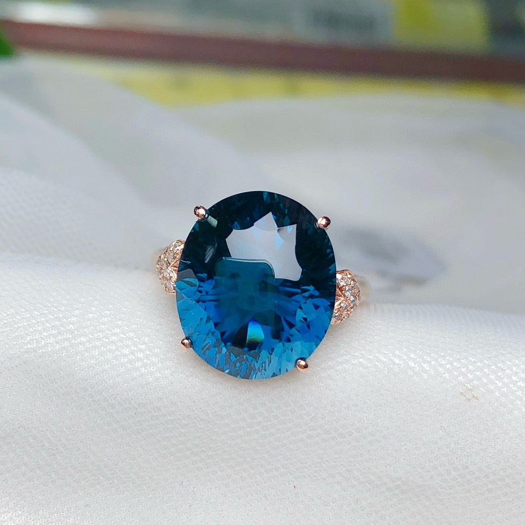 14k Gold 10.45 Ct Natural Topaz & Diamond Ring: Ref:230975212 // gold content:14k gold // ring size:7. 25us // // main gemstone:topaz // shape:oval // carat weight:10. 45ct // color:blue // treatment:natural // // adjacent gemstone 2 : diamond