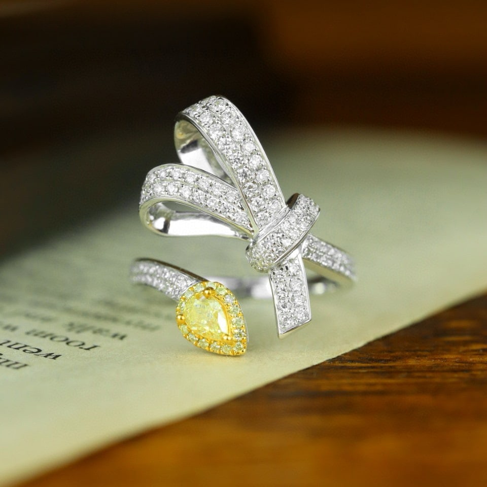 14k Gold 0.67 Ctw Natural Yellow Diamond & Diamond Ring: Ref:230976016 // gold content:14k gold // ring size:7. 25us // // main gemstone:yellow diamond // shape:pear // carat weight:0. 22ct // color:yellow // treatment:natural // // adjacent gemstone 2