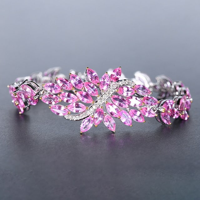 14k Gold 13.11 Ctw Natural Padparadscha Sapphire & Diamond Bracelet: Ref:230976093 // gold content:14k gold // main gemstone:padparadscha sapphire // shape:marquise // carat weight:13ct // color:orangish pink // treatment:natural // // adjacent gemstone 2 : diamond