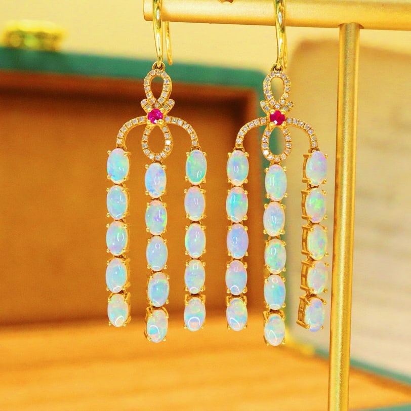 14k Gold 4.40 Ctw Natural Opal & Diamond Earrings: Ref:230976120 // gold content:14k gold // main gemstone:opal // shape:oval // carat weight:4. 16ct // color:white // treatment:natural // // adjacent gemstone 2 : diamond // number of stones:82 //