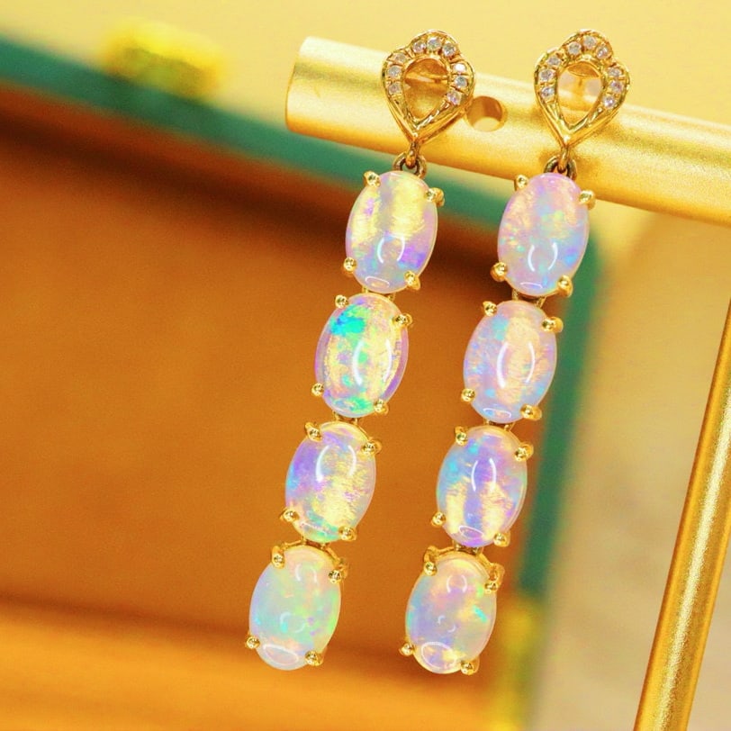 14k Gold 3.41 Ctw Natural Opal & Diamond Earrings: Ref:230976123 // gold content:14k gold // main gemstone:opal // shape:oval // carat weight:3. 36ct // color:white // treatment:natural // // adjacent gemstone 2 : diamond // number of stones:18 //