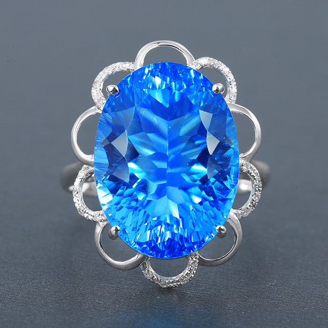 14k Gold 15.54 Ctw Natural Topaz & Diamond Ring: Ref:230976281 // gold content:14k gold // ring size:7. 25us // // main gemstone:topaz // shape:oval // carat weight:15. 48ct // color:blue // treatment:natural // // adjacent gemstone 2 : diamond
