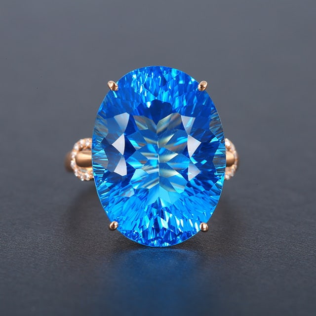 14k Gold 19.97 Ctw Natural Topaz & Diamond Ring: Ref:230976283 // gold content:14k gold // ring size:7. 25us // // main gemstone:topaz // shape:oval // carat weight:19. 91ct // color:blue // treatment:natural // // adjacent gemstone 2 : diamond