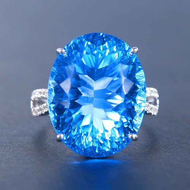 14k Gold 23.23 Ctw Natural Topaz & Diamond Ring: Ref:230976319 // gold content:14k gold // ring size:7. 25us // // main gemstone:topaz // shape:oval // carat weight:23. 18ct // color:blue // treatment:natural // // adjacent gemstone 2 : diamond