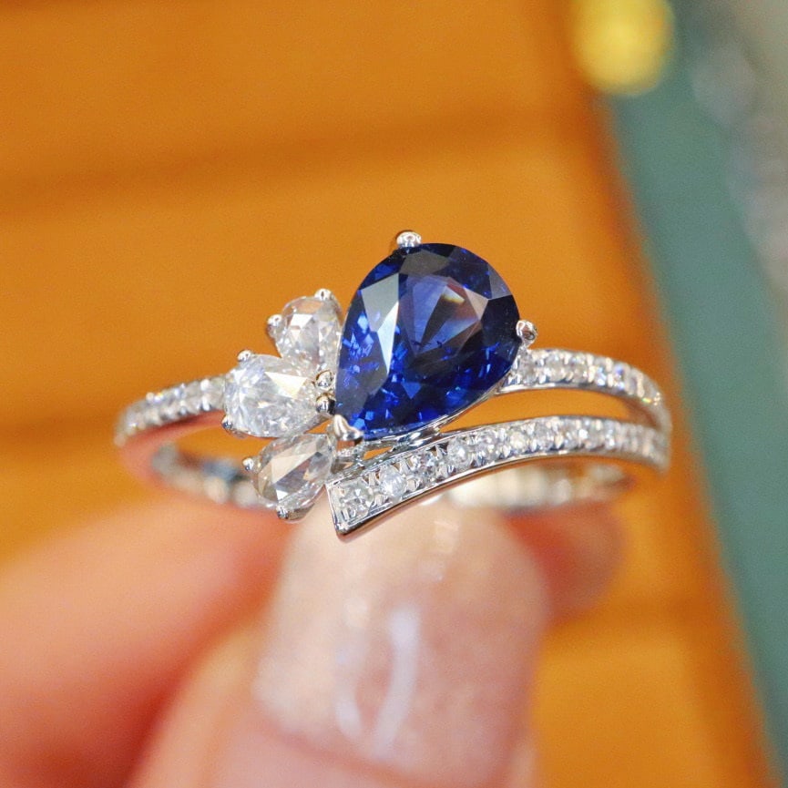 14k Gold 1.30 Ctw Natural Sapphire & Diamond Ring: Ref:230976339 // gold content:14k gold // ring size:7. 25us // // main gemstone:sapphire // shape:pear // carat weight:1. 08ct // color:royal blue // treatment:natural // // adjacent gemstone 2 :