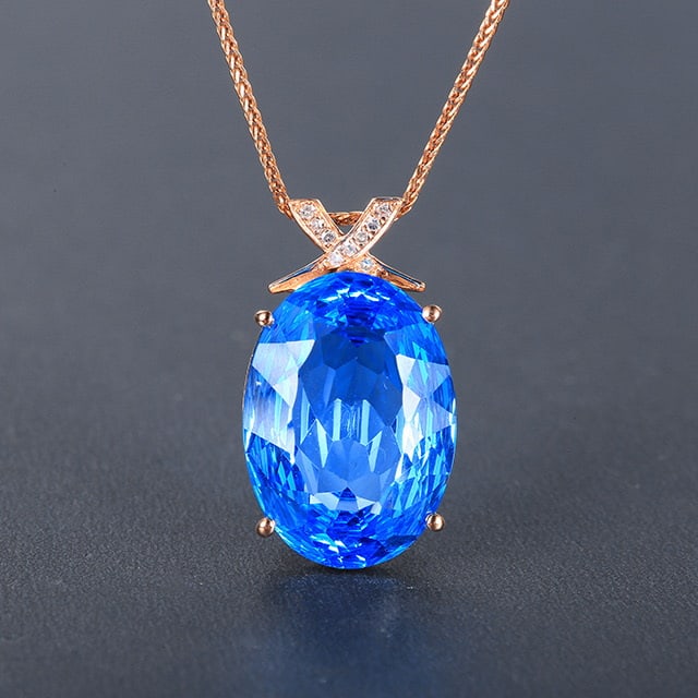 14k Gold 9.90 Ctw Natural Topaz & Diamond Pendant( Without Chain ): Ref:230976408 // gold content:14k gold // main gemstone:topaz // shape:oval // carat weight:9. 88ct // color:blue // treatment:natural // // adjacent gemstone 2 : diamond // number of stones:9 //